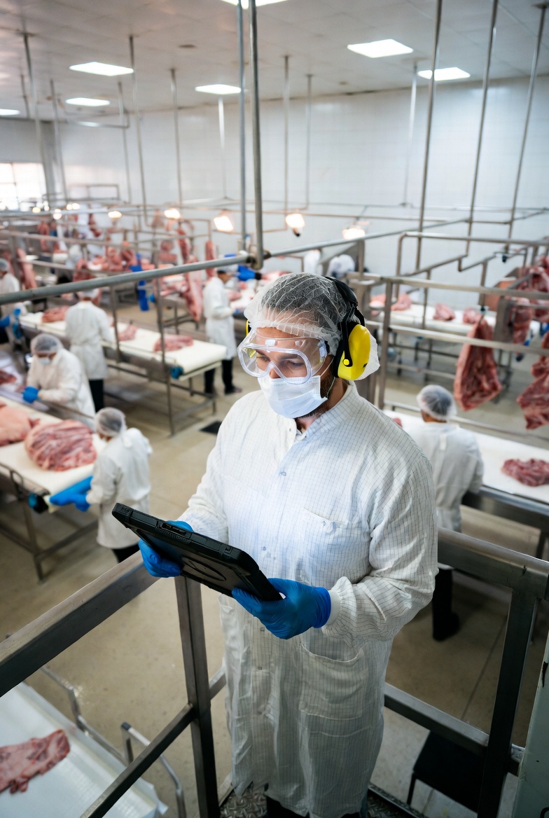 Factory quality control worker using app